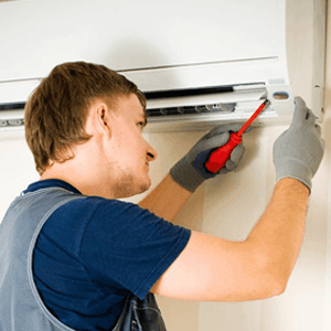 ASAP AIR employee installing air conditioner
